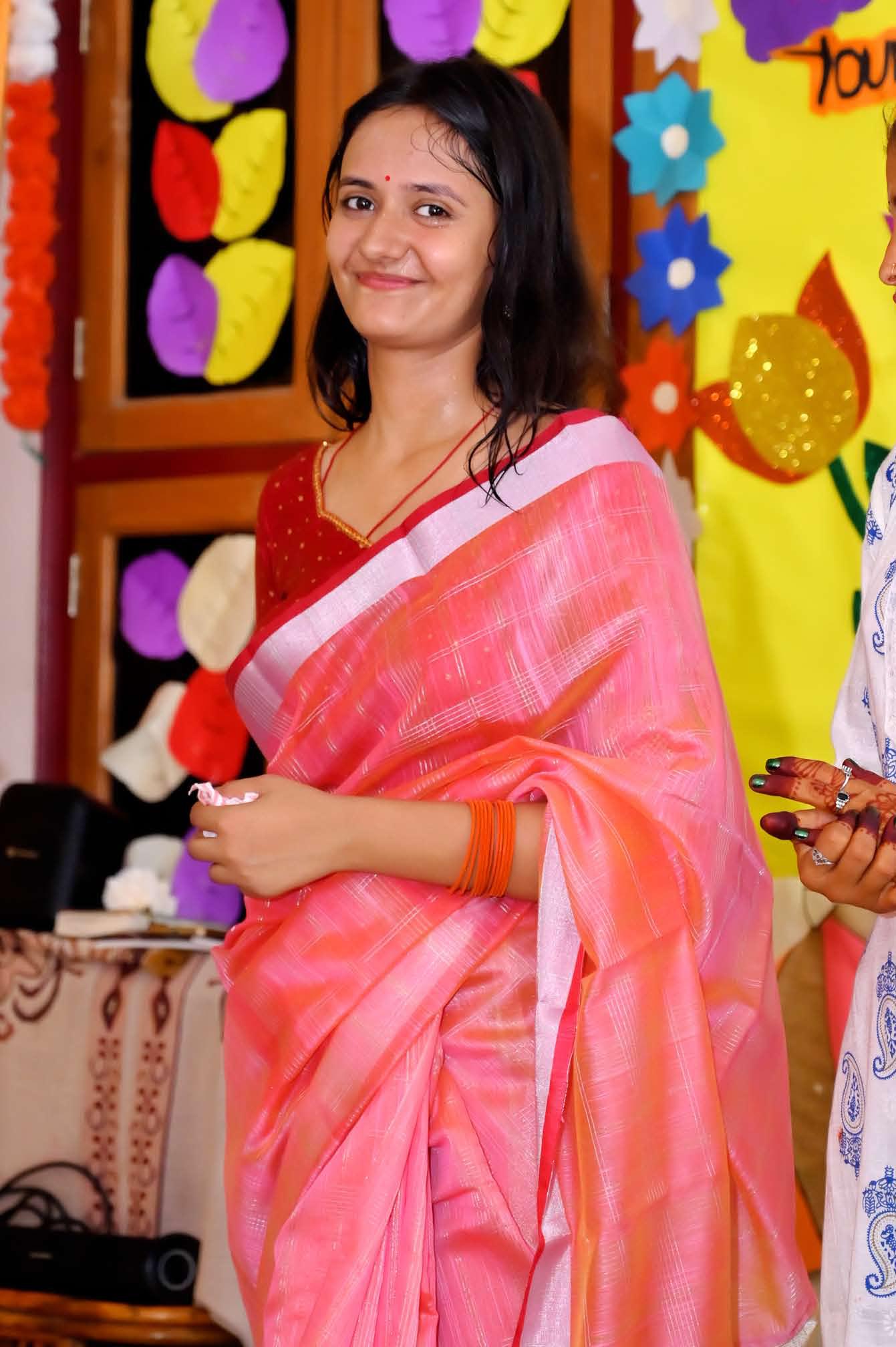 A teacher in the decorated classroom